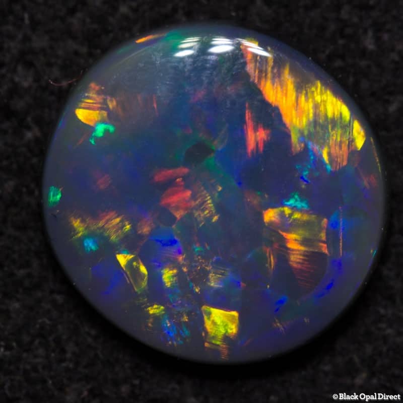 0.64 ct black opal 7x6.5x2mm