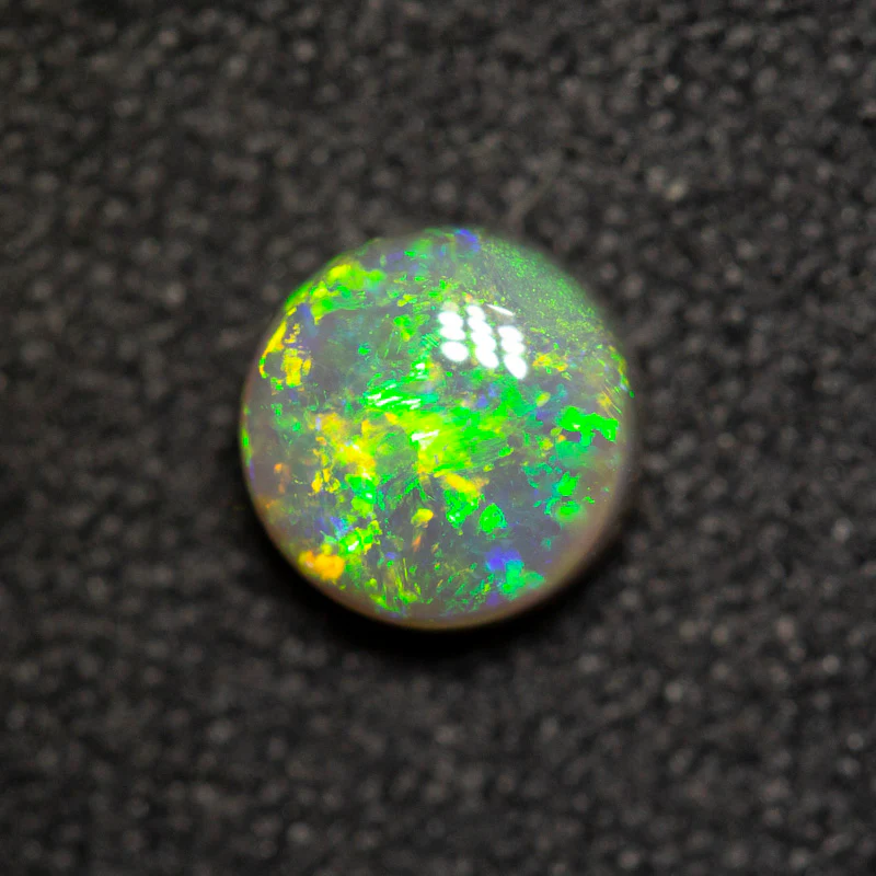0.64 ct dark opal 5.4x5.4x3.1mm