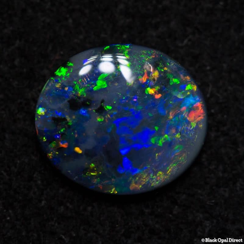 0.64 ct dark opal 7x6x2mm