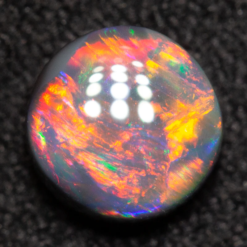 0.65 ct black opal 5.6x5.5x3.1mm