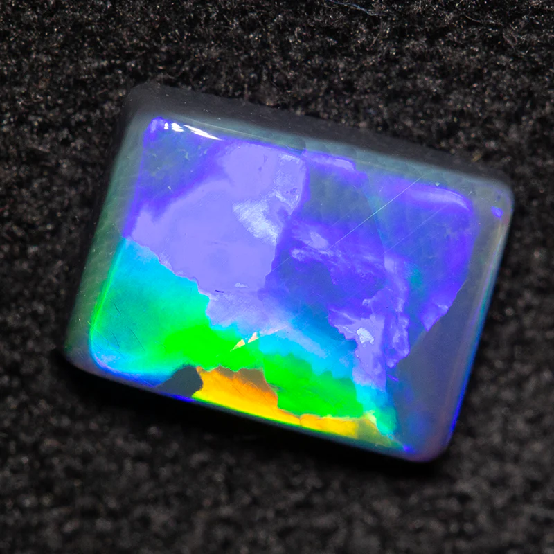 0.65 ct black opal 6.9x5.2x2mm
