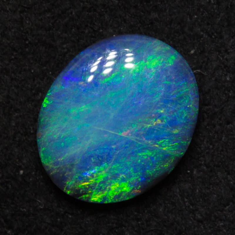 0.65 ct black opal 7x6x2mm