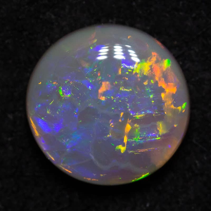 0.65 ct dark opal 6.4x6.4x2.5mm