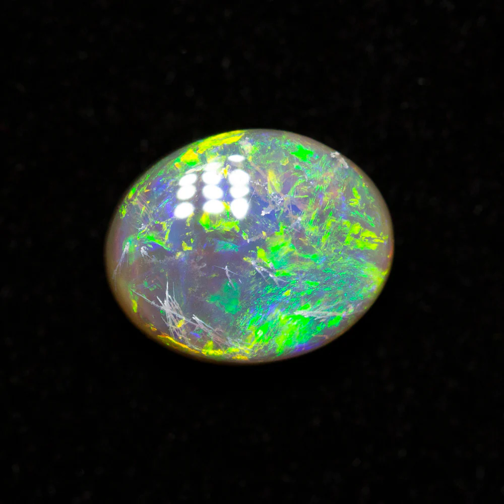 0.65 ct dark opal 6.5x5.3x2.9mm