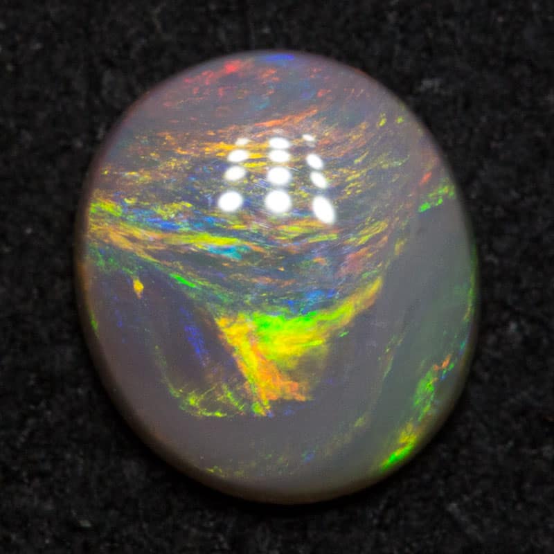 0.65 ct dark opal 6.8x6x2.5mm