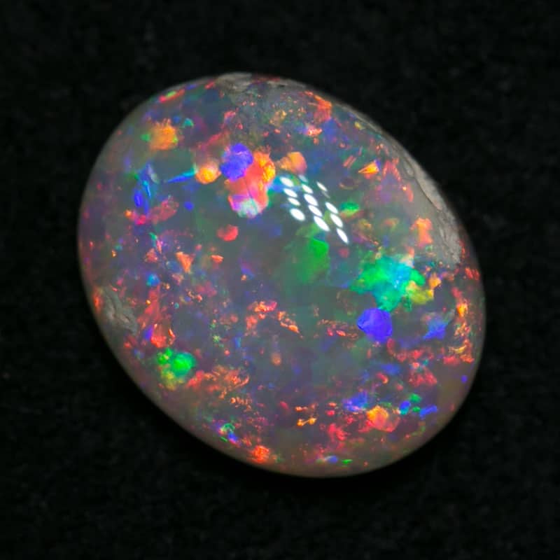 0.65 ct dark opal 7x5x2mm