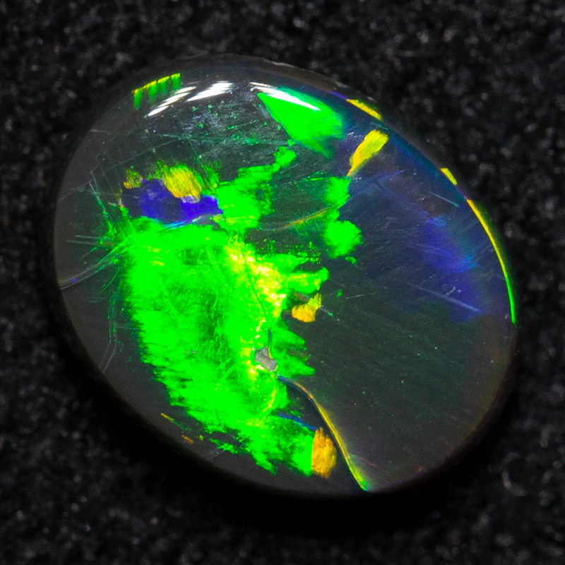 0.66 ct black opal 6.9x5.4x2.5mm