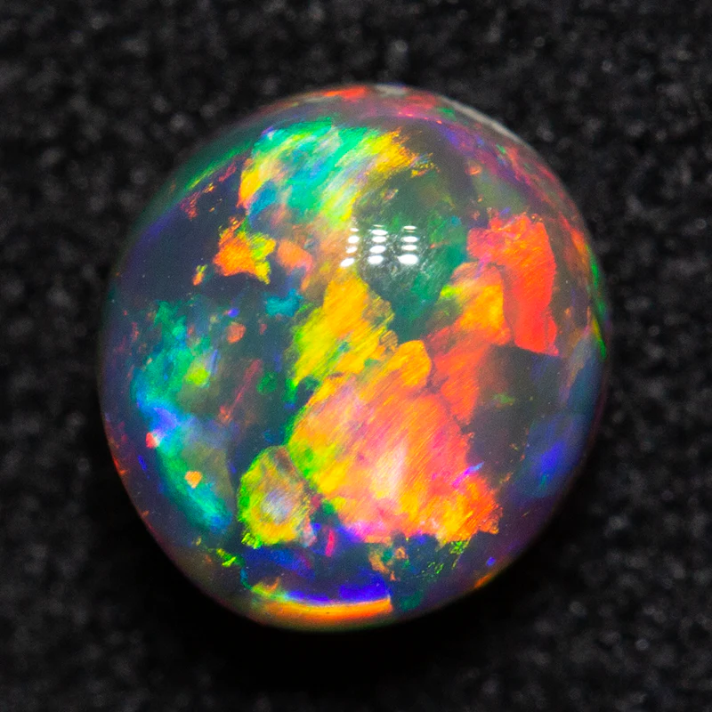 0.67 ct black opal 5.6x5.2x3.7mm