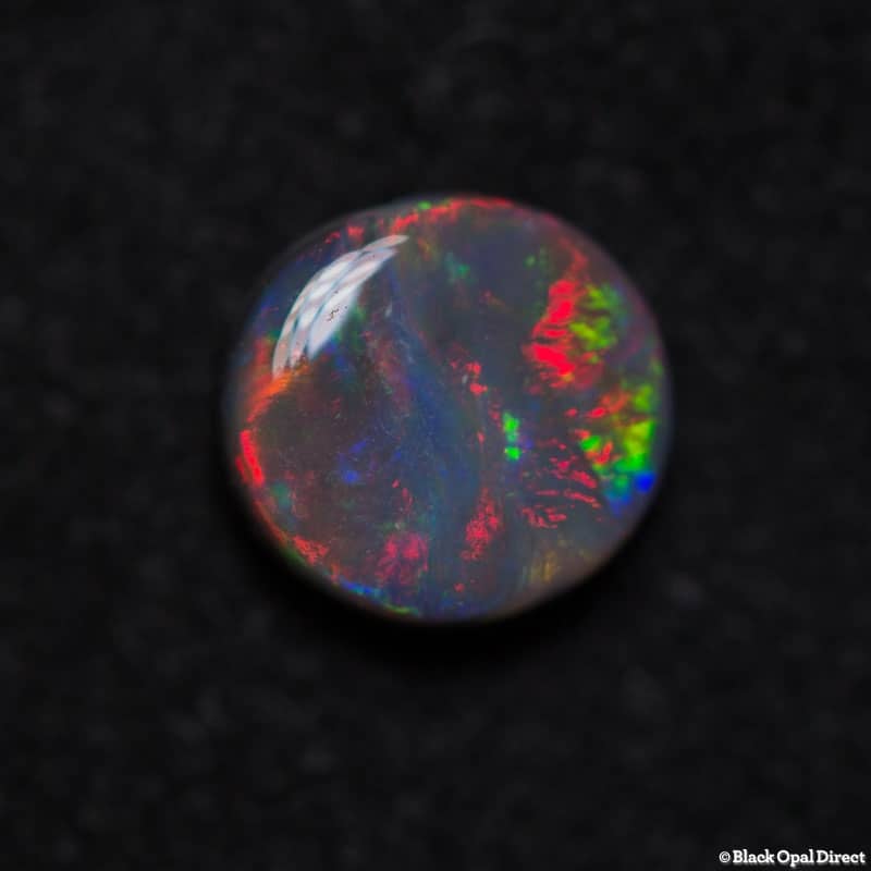 0.67 ct black opal 6mm round x 3mm