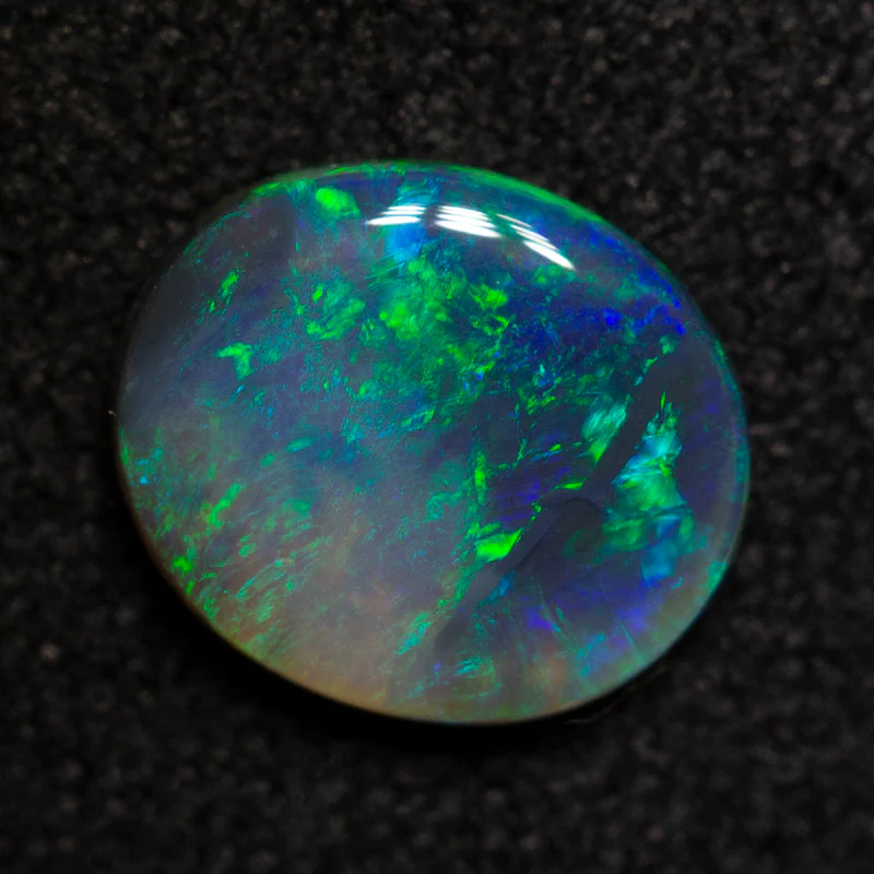 0.67 ct black opal 7.6x6.5x1.8mm