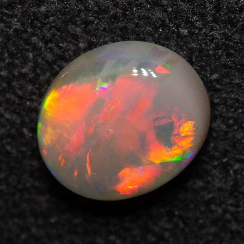 0.67 ct dark opal 6.4x5.5x2.7mm