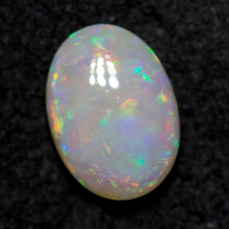 0.67 ct dark opal 7.4x5.4x2.7mm