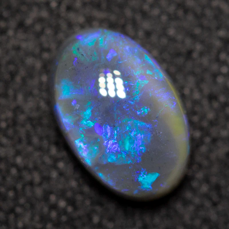 0.68 ct black opal 7.1x4.7x3mm