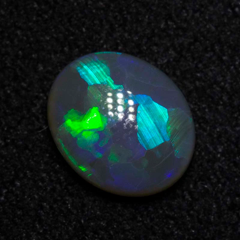 0.68 ct black opal 7.1x5.9x2.6mm