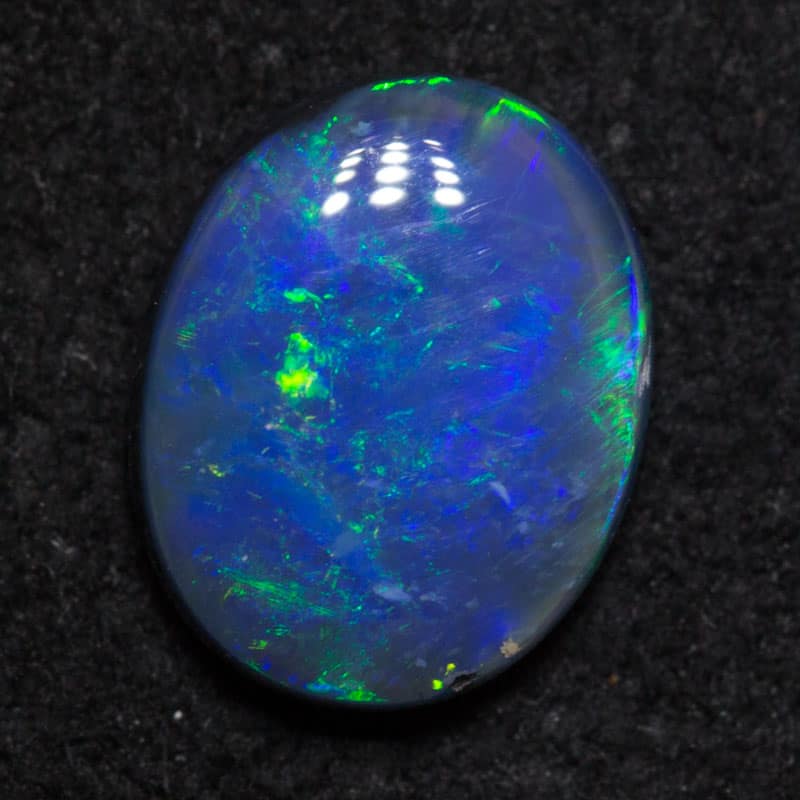 0.68 ct black opal 7.3x5.9x2.4mm