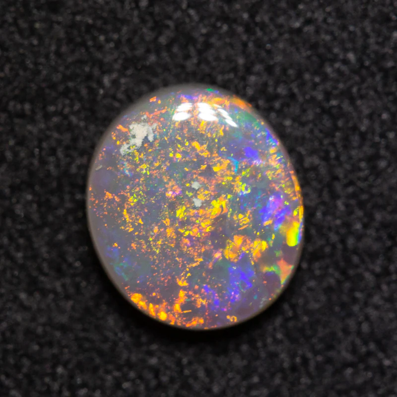 0.68 ct dark opal 6.8x5.9x2.4mm