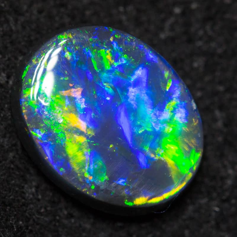0.69 ct black opal 7.4x5.9x2.3mm