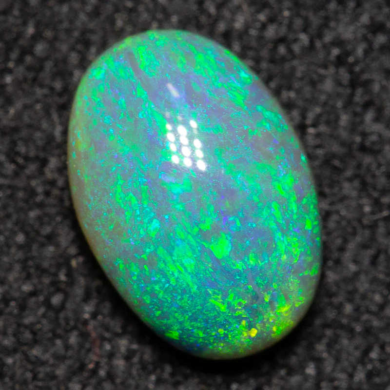 0.69 ct dark opal 7.1x4.9x3.2mm