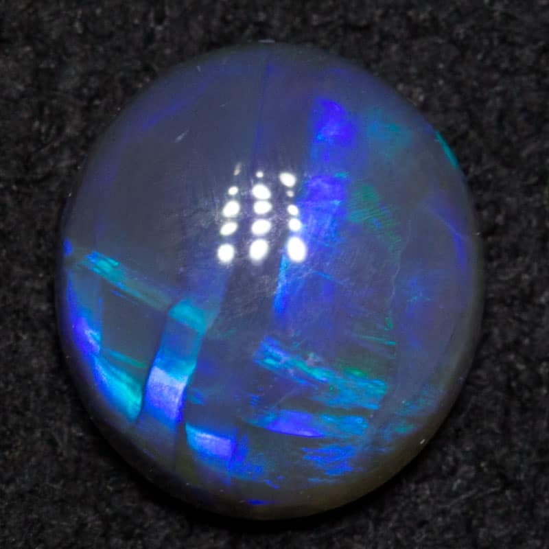 0.70 ct black crystal opal 6.6x5.9x2.8mm