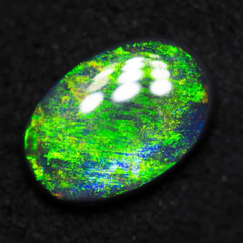0.70 ct black opal 8.1x5.6x2.2mm