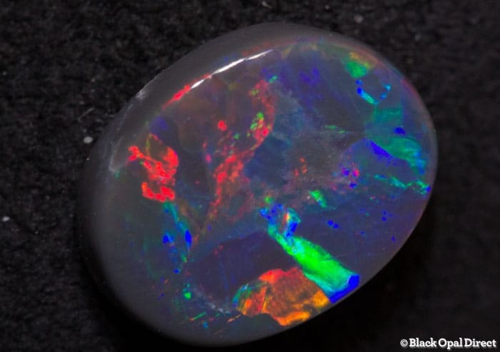0.70 ct black opal gem 7x5.5x2mm