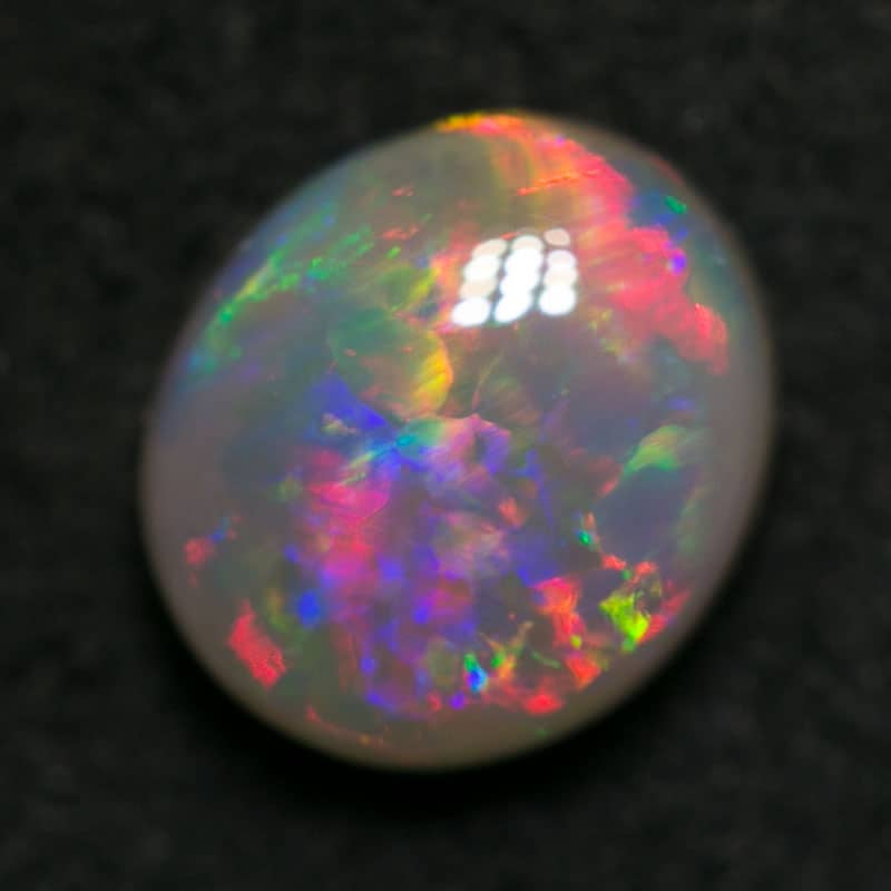 0.70 ct dark opal 6x5.5x3mm