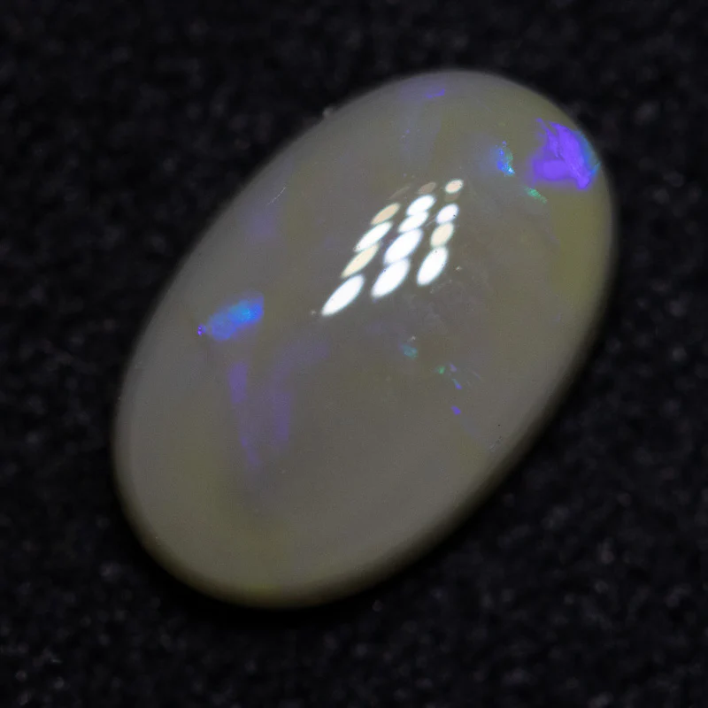 0.70 ct dark opal 7.5x4.8x2.9mm