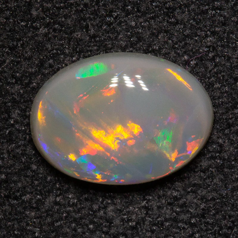 0.70 ct dark opal 8.1x5.9x2.2mm