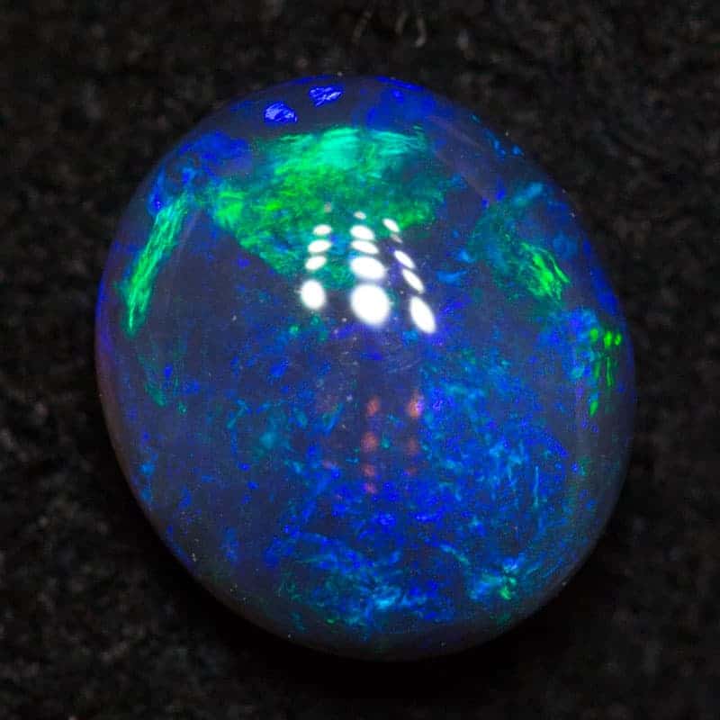 0.71 ct black crystal opal 6.4x5.7x3.1mm