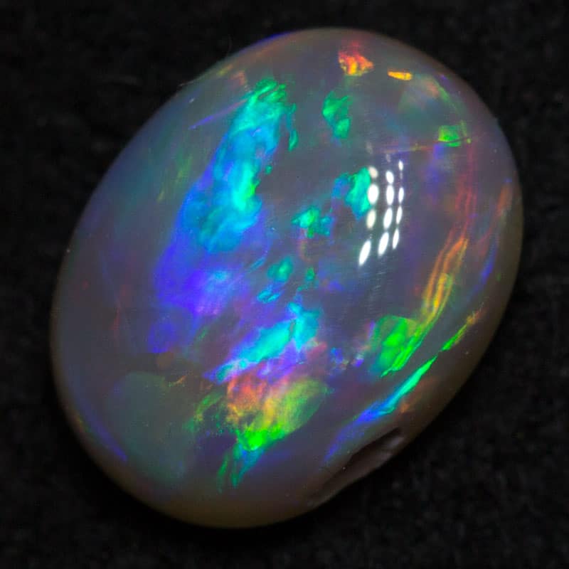 0.71 ct dark opal 7x5x3mm