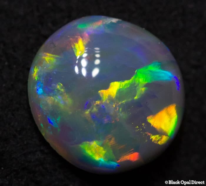 0.71 ct semi black opal 7x6.5x3.5mm