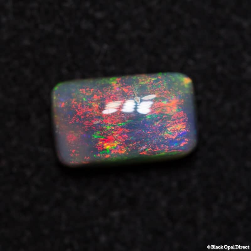 0.71 ct semi black opal cushion 7x4x3mm