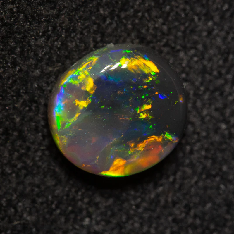 0.72 ct black opal 6.3x5.7x3.1mm