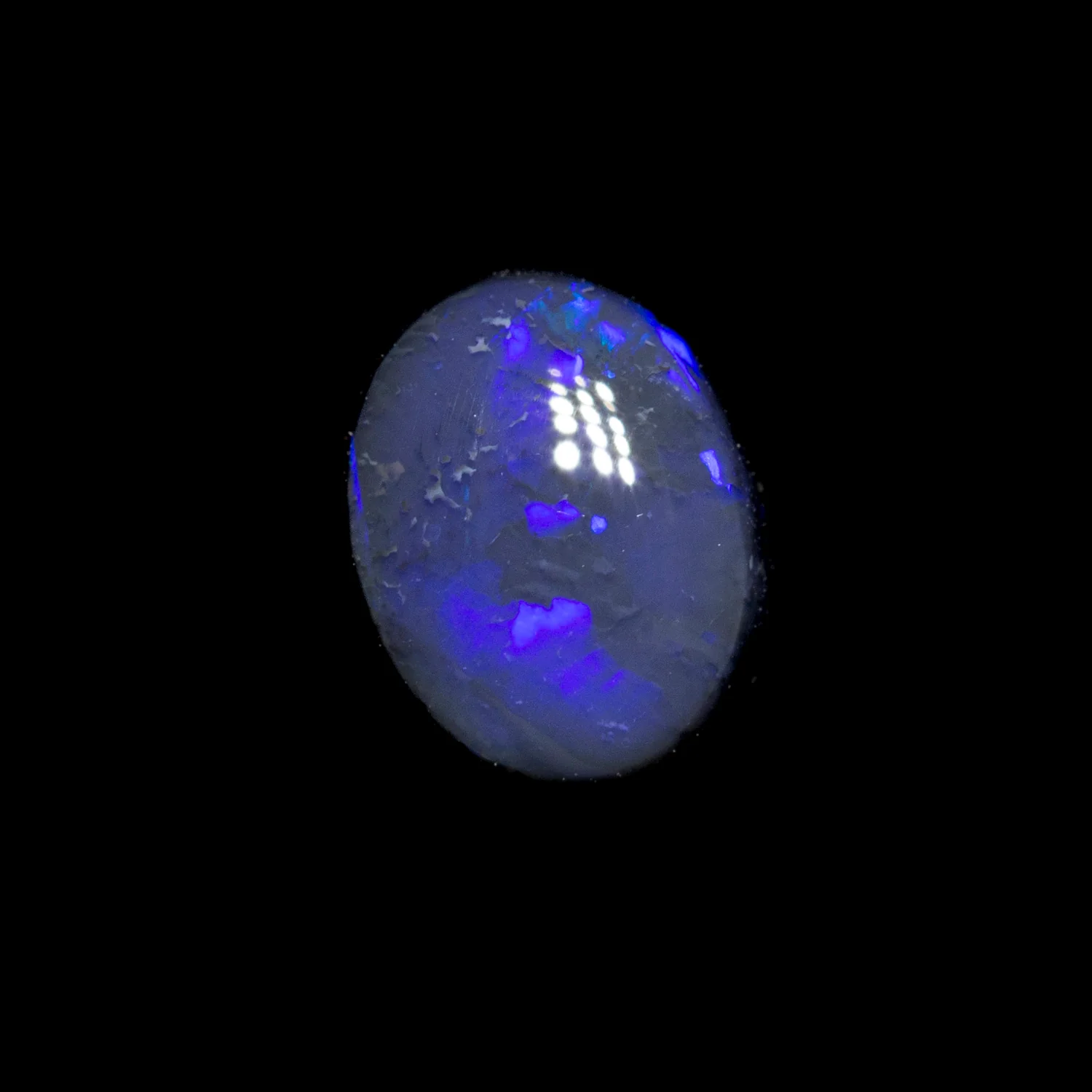 0.72 ct black opal 6.9x5.3x2.9mm