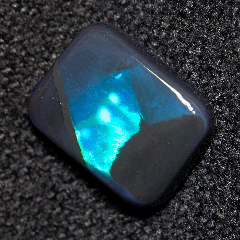 0.72 ct black opal 7.4x5.7x2mm