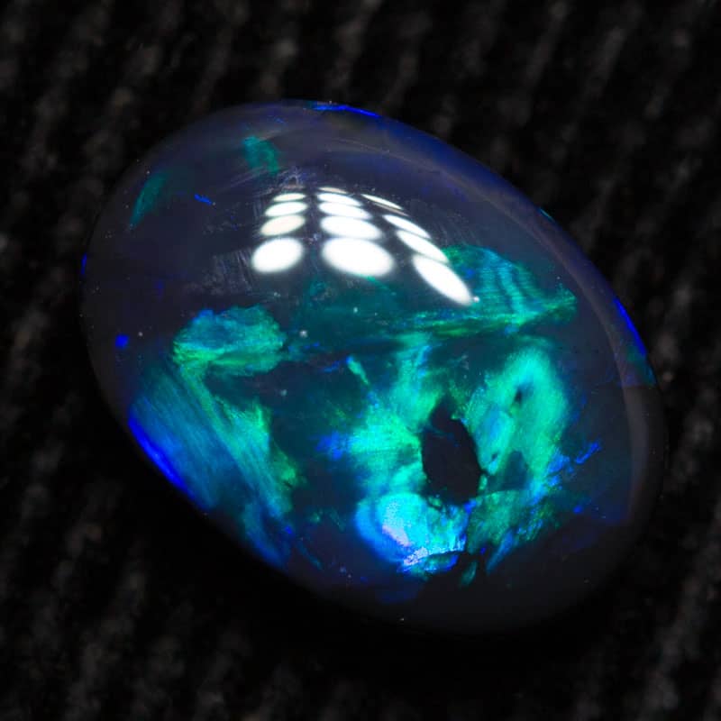 0.72 ct black opal 7.5x5.5x2.5mm