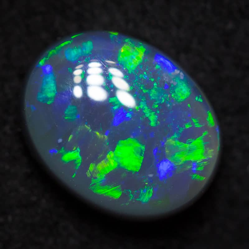 0.72 ct dark opal 6.8x5.5x3mm