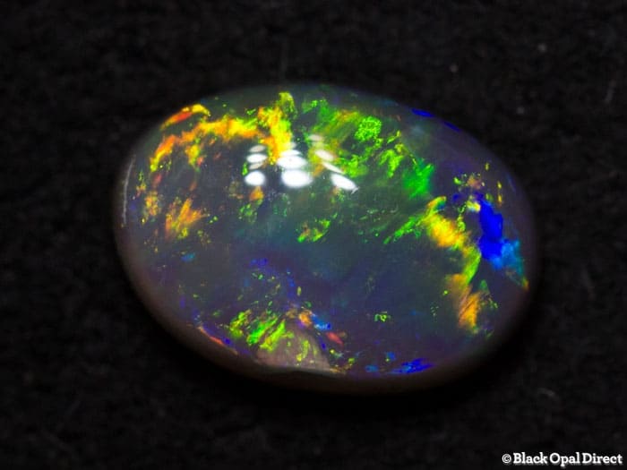 0.72 ct dark opal 7x5x3mm