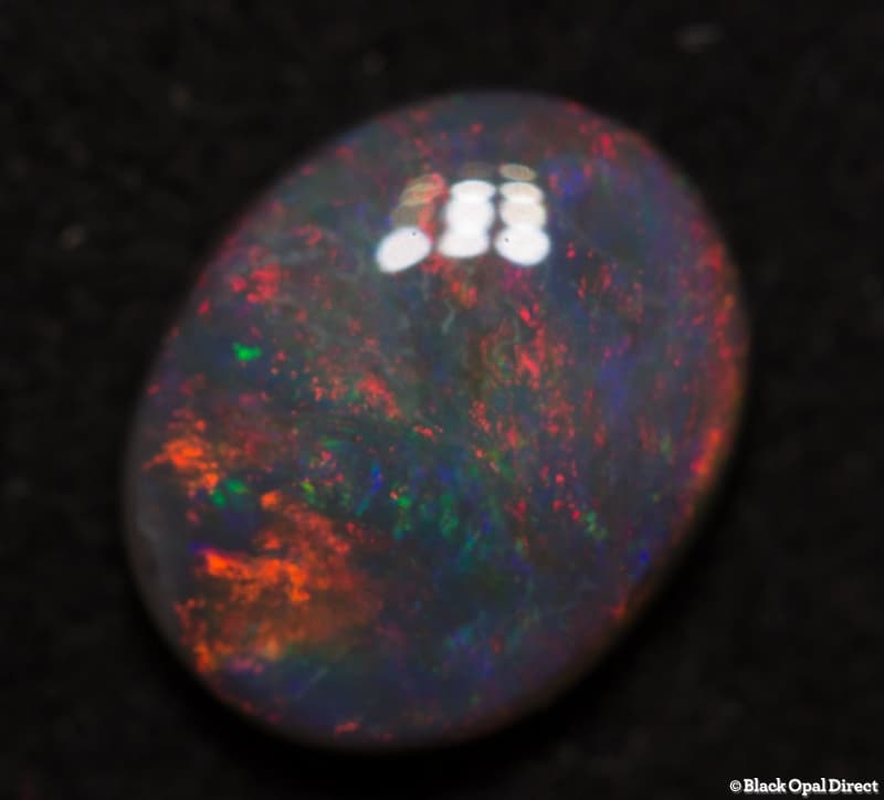 0.72 ct semi black opal 7x6x2mm