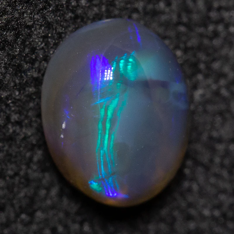 0.74 ct black opal 6.6x5.1x3.5mm