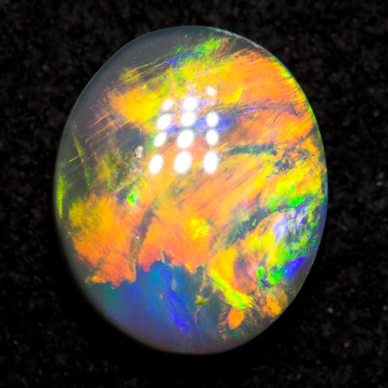 0.74 ct black opal 7.1x5.9x2.7mm