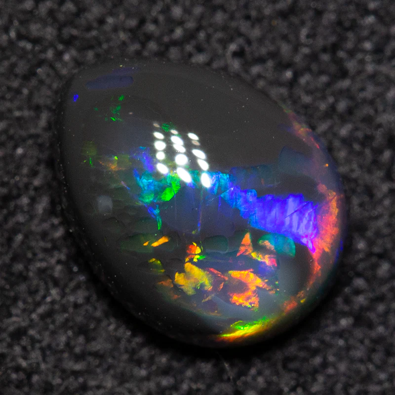 0.74 ct black opal 7.2x5.5x3.3mm