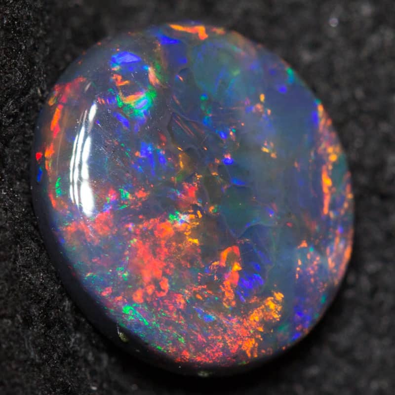 0.74 ct black opal 7.4x6.6x2.4mm