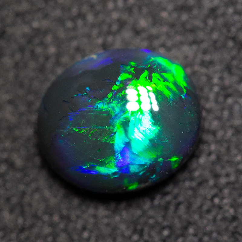 0.74 ct black opal 7x6x3mm