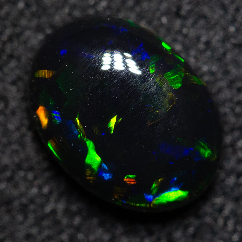 0.75 ct black opal 7.1x5.3x2.9mm
