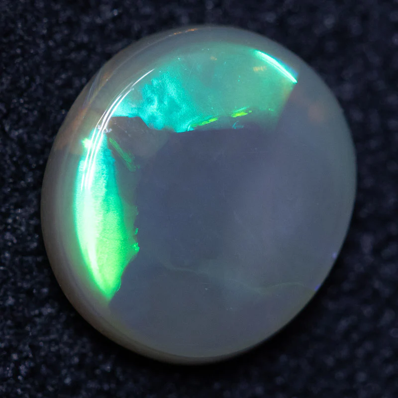 0.75 ct dark opal 7.3x6.6x2.3mm