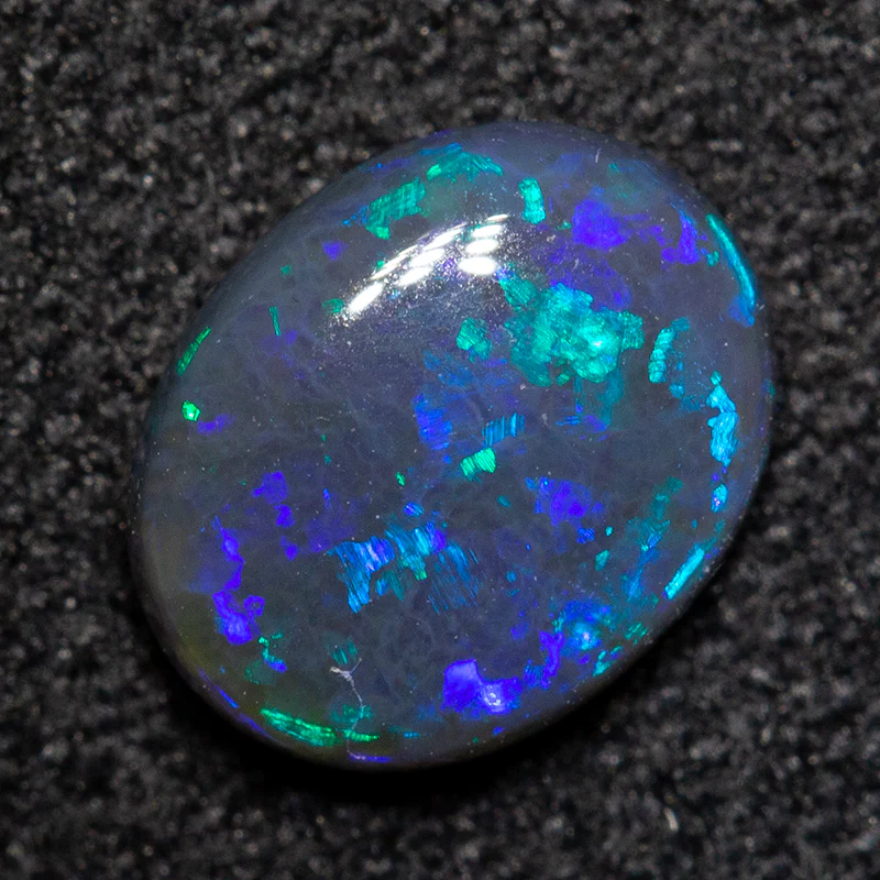 0.76 ct black opal 7.2x5.9x2.6mm