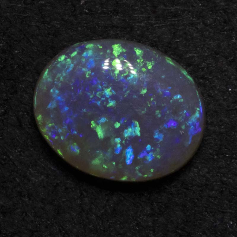 0.76 ct black opal 7.5x6.1x2.8mm