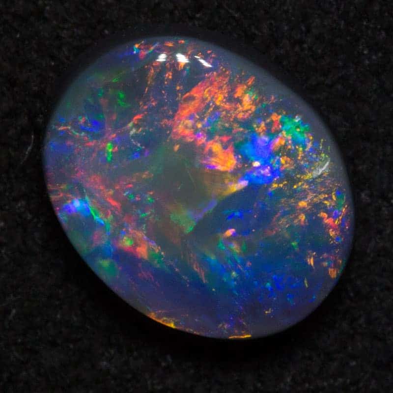 0.76 ct black opal 7x5.6x2.5mm