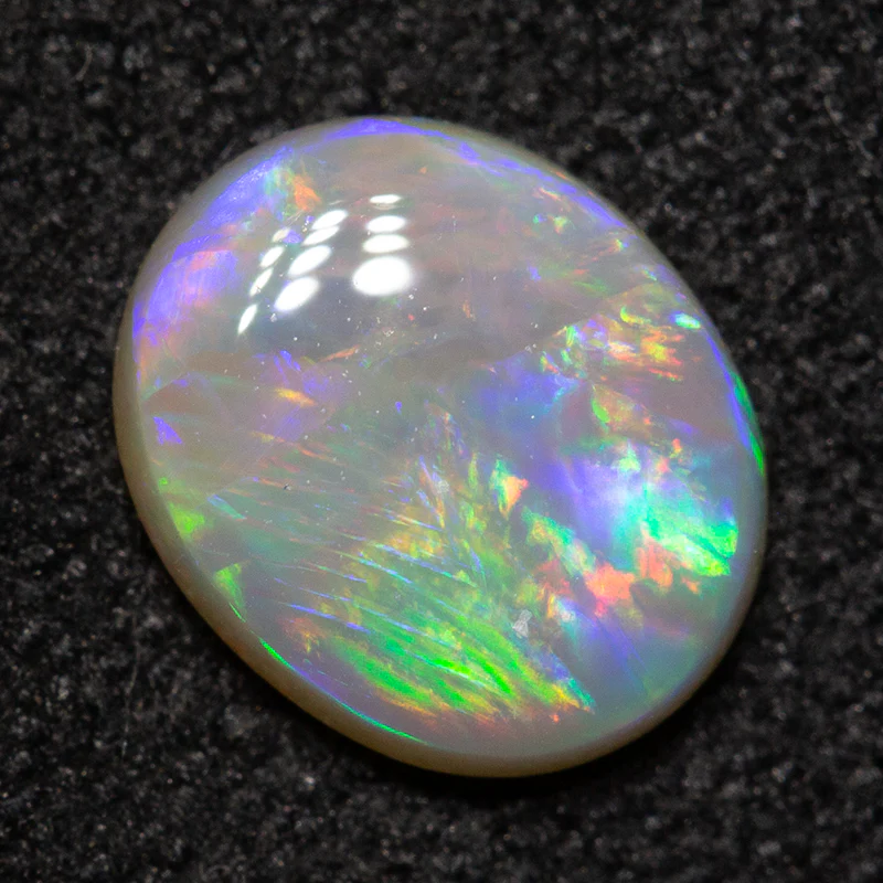0.76 ct white opal 7.5x6.2x2.3mm